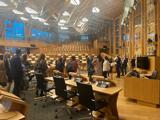 A group of people in the Parliamentary Chamber in Holyrood